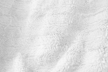 Beyaz, temiz yün dokusu arka planda. hafif doğal koyun yünü. Beyaz, pürüzsüz pamuk. Tasarımcılar için tüylü kürk dokusu. yakın plan beyaz yün halı..