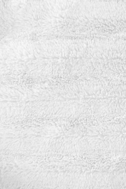 Beyaz, temiz yün dokusu arka planda. hafif doğal koyun yünü. Beyaz, pürüzsüz pamuk. Tasarımcılar için tüylü kürk dokusu. yakın plan beyaz yün halı..