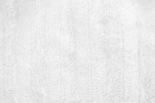 Beyaz, temiz yün dokusu arka planda. hafif doğal koyun yünü. Beyaz, pürüzsüz pamuk. Tasarımcılar için tüylü kürk dokusu. yakın plan beyaz yün halı..