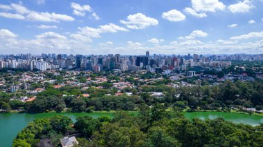 Aerial view of Ibirapuera Park in Sao Paulo, SP. Residential buildings around. Lake in Ibirapuera Park.
