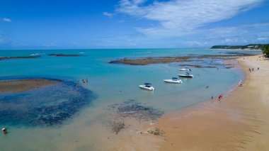 Aerial view of Praia do Espelho, Porto Seguro, Bahia, Brazil. Natural pools in the sea, cliffs and greenish water.