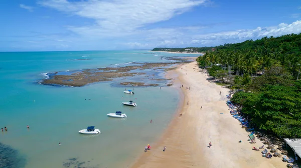 Aerial view of Praia do Espelho, Porto Seguro, Bahia, Brazil. Natural pools in the sea, cliffs and greenish water.