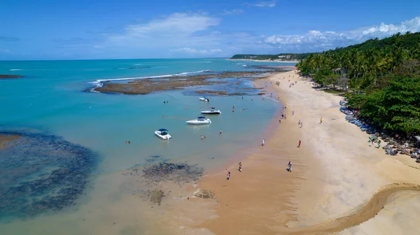 Aerial view of Praia do Espelho, Porto Seguro, Bahia, Brazil. Natural pools in the sea, cliffs and greenish water.