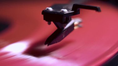 vinyl player. pink plate Black background