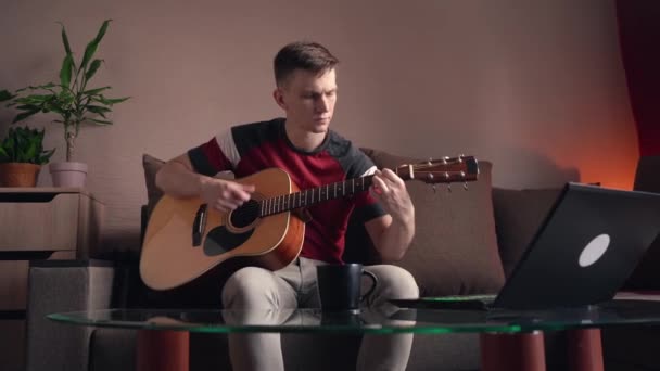 Young Man Learning Play Acoustic Guitar Online Home — Stock Video