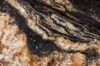 Parlak granit levhanın dokusu. Kabarık bir dokusu olan sert bir kaya.