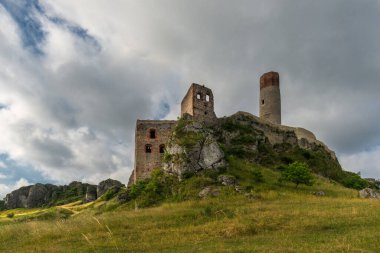 Olsztyn, Silesian Voivodeship, Poland, July 10, 2021: Stormy clouds over gothic castle ruins located in Polish Jura.