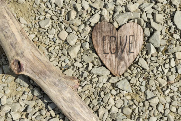 Handmade Heart Shaped Wood Slice Placed Rocky Beach Stones Burnt — Stockfoto