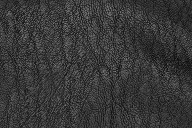 Yapay siyah deri dokusu yakın plan. Katı desenli arka plan.