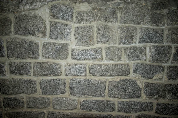 Rock salt wall in salt mine resembling brick wall or stone blocks wall. Background texture.