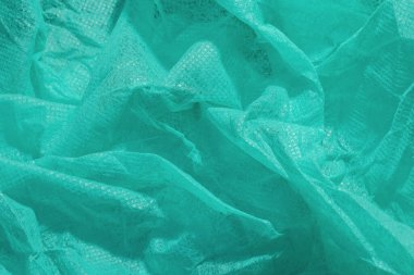 Doktorun önlüğü, sağlık hizmetleri, ev halkı, gıda endüstrisi ve korunmaya ihtiyacı olan diğerleri için kullanılan kırışık koruyucu giysi örneği..