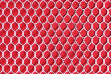 Kırmızı arka planda beyaz çamaşırhane ve spor ağı. Altıgen şeklinde dikişli kumaş dokusu. Desenli arkaplan.