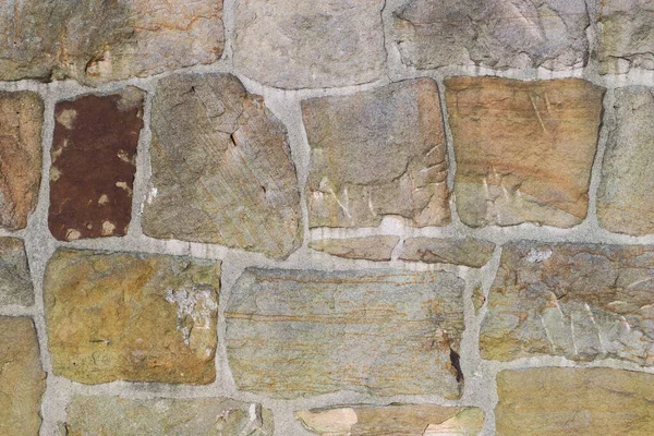 Arka plan ya da doku olarak kullanılacak taş bir duvarın parçası. Mason inşaatı.