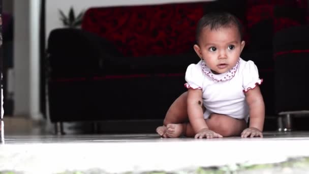 Beautiful Brown Skinned Latina Baby Girl Looking Ground Very Concentrated — Stock Video