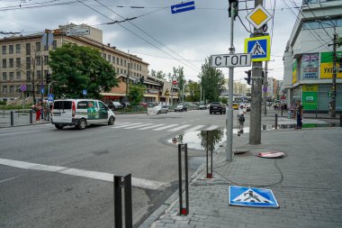 The road sign has fallen. The road sign is broken. Road. No travel. Stop sign. Pedestrian crossing sign. The wind blew off road signs.