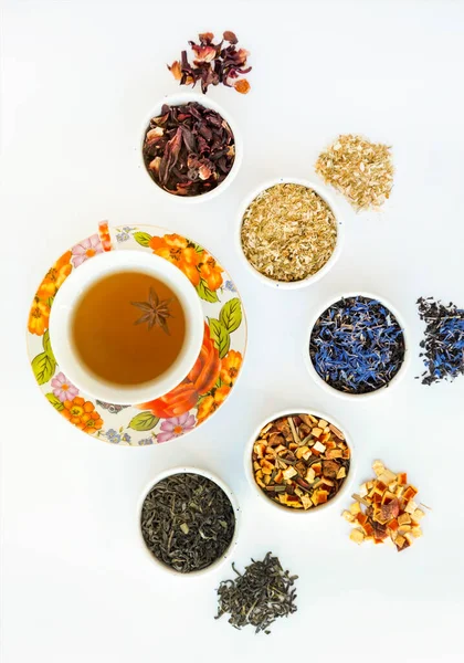 Natural herbal tea of different varieties. Variety of dry tea in utensils, close up