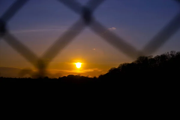 Sunset Sunrise Metal Mesh Fence Bright Orange Sun Background Blue — 스톡 사진