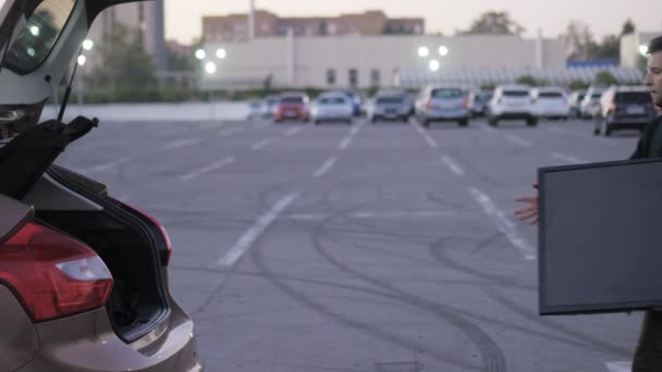 Man Drops New Purchased Supermarket Parking Unsuccessfully Delivered Car Trunk — Video Stock