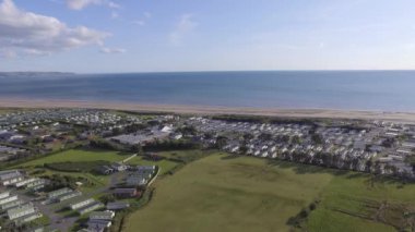 drone video, aerial view, Flying over caravans towards sea