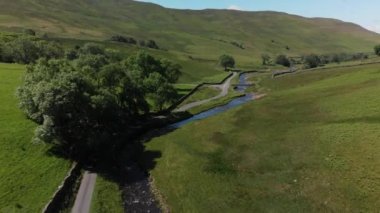 drone video, pullback aerial shot of Barbon Beck, Cumbria
