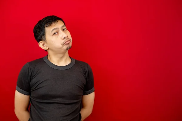 Portrait Asian Man Sullen Expression Empty Space Next Him Red — Stock Photo, Image