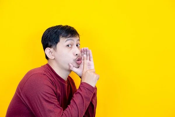 Cute Asian Man Wearing Red Shirt Whispering Expression Yellow Background — Stock Photo, Image