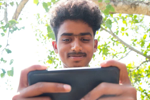 Close Rural Boy Using Mobile Phone Outdoor — Stockfoto