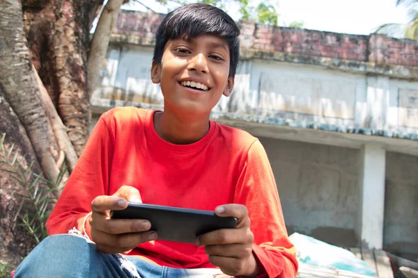 Smiling Rural Boy Using Mobile Phone Outdoor — Stock Photo, Image