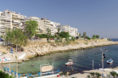 A view of coast sea and greek houses background. Colorful Mediterranean architecture on a sunny clear day. close up