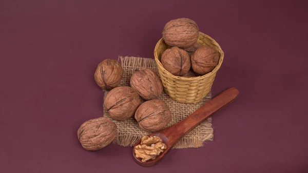 Pile Walnuts Wooden Spoon Purple Background — Stock Photo, Image