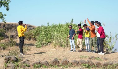 Group of people taking photo outdoors