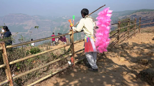 People on mountain top in India