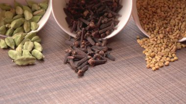 Indian Spices and herbs on wooden background. Food and cuisine ingredients.