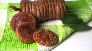 Fresh figs or anjeer fruits healthy vegan food concept organic dry fruits on colorful cloth background