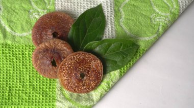 Fresh figs or anjeer fruits healthy vegan food concept organic dry fruits on colorful cloth background