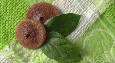 Fresh figs or anjeer fruits healthy vegan food concept organic dry fruits on colorful cloth background