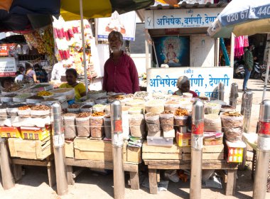 Man selling spices in Indian town