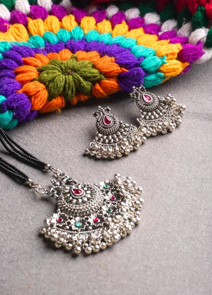 Indian Traditional Antique Retro Style Pendant Earrings Colorful Knitted Background — Stockfoto