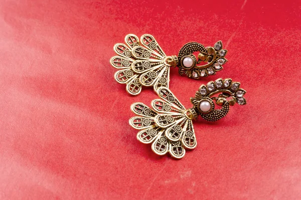 Beautiful Earrings Red Background — Photo