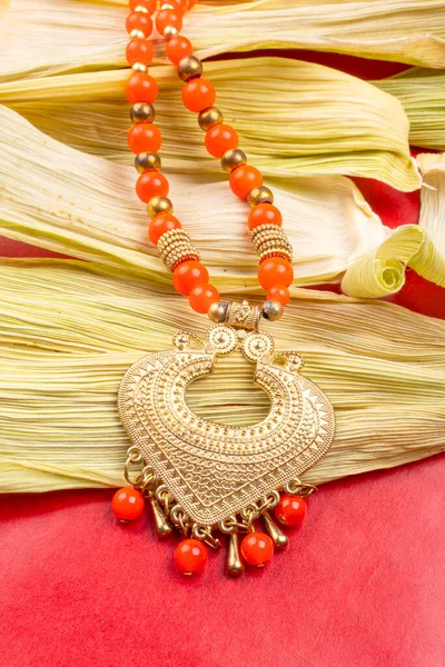Beautiful Traditional Indian Necklace Heart Form Corn Leaves Red Background — Stockfoto