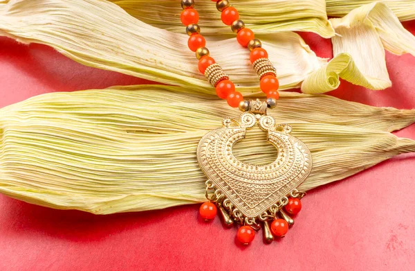 Beautiful Traditional Indian Necklace Heart Form Corn Leaves Red Background — Foto de Stock