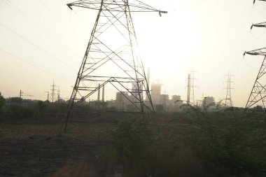 Landscape with power station on background at sunset 