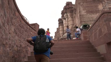 People in ancient castle or temple in India