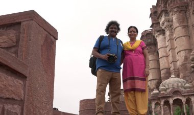 People in ancient castle or temple in India