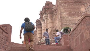 People in ancient castle or temple in India