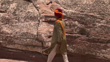 Side view of Indian man walking 