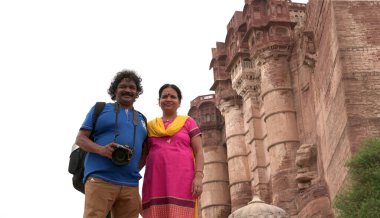 Indian couple near ancient temple