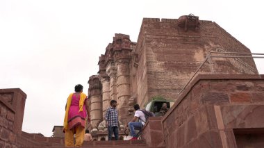 People in ancient castle or temple in India
