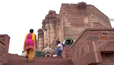 People in ancient castle or temple in India