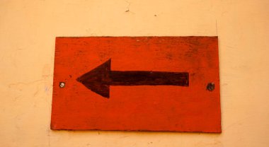 Arrow sign on building wall